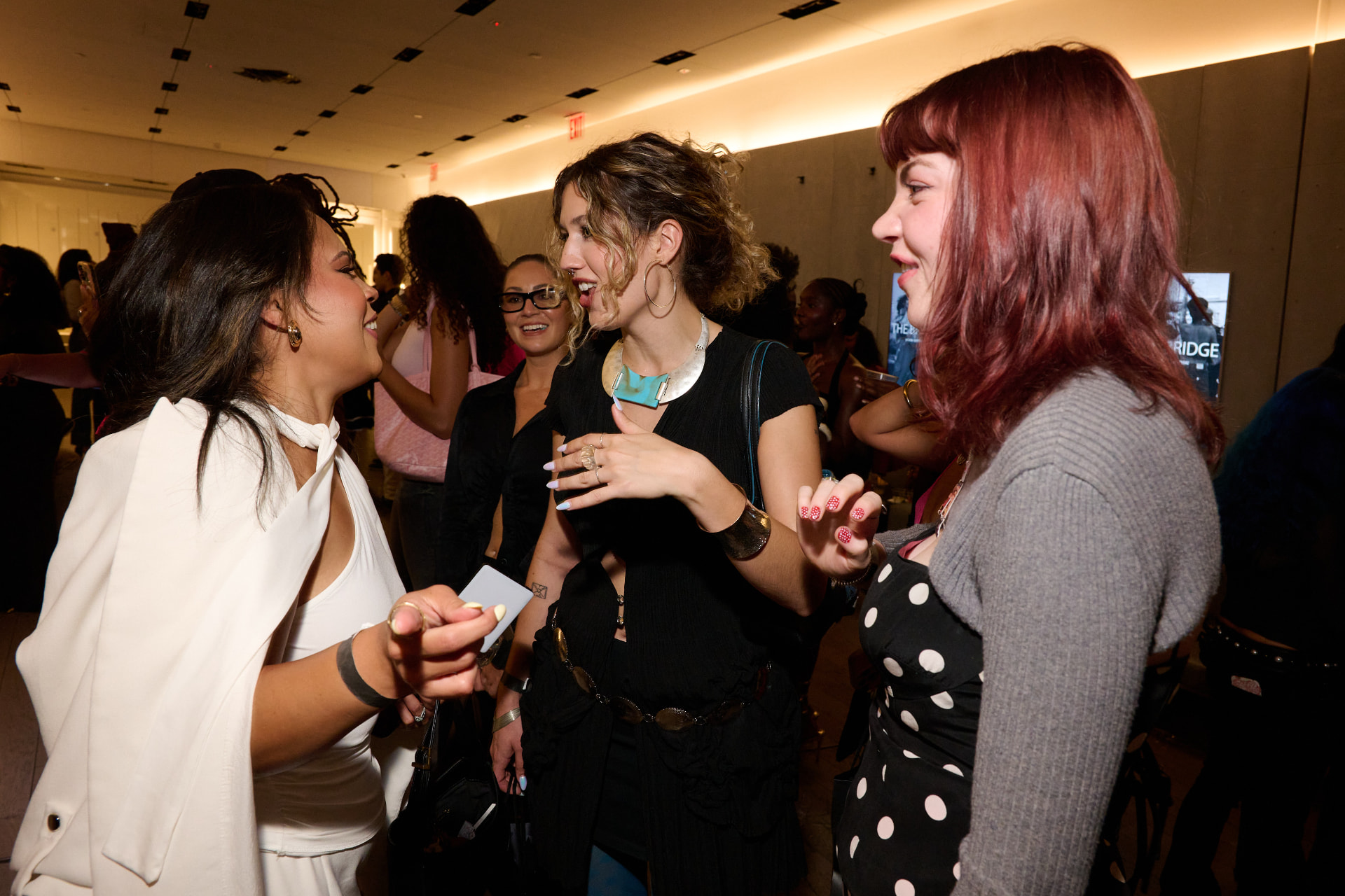 Guests in conversation at a THE BRIDGE live gathering